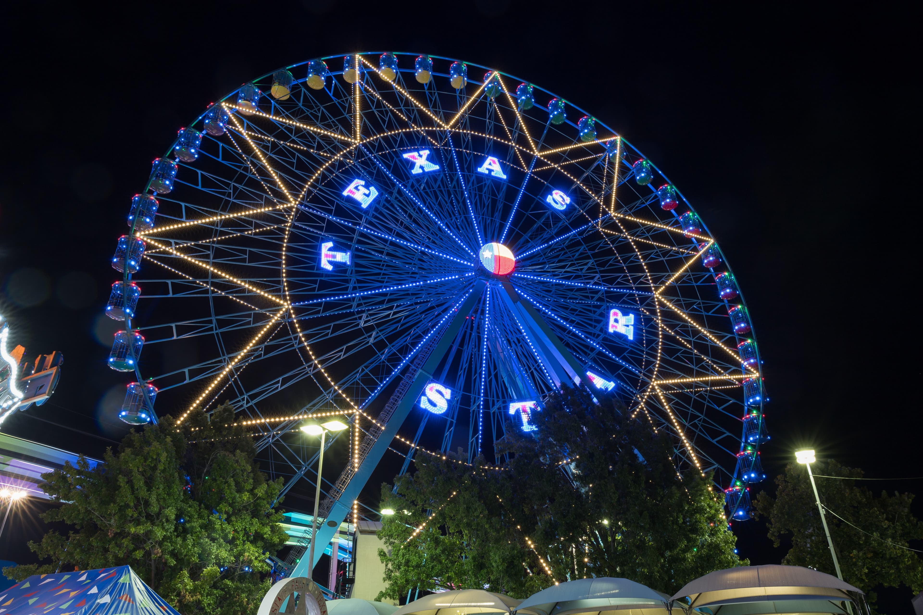 File photo: The Texas Star Ferris wheel is illuminated at night.